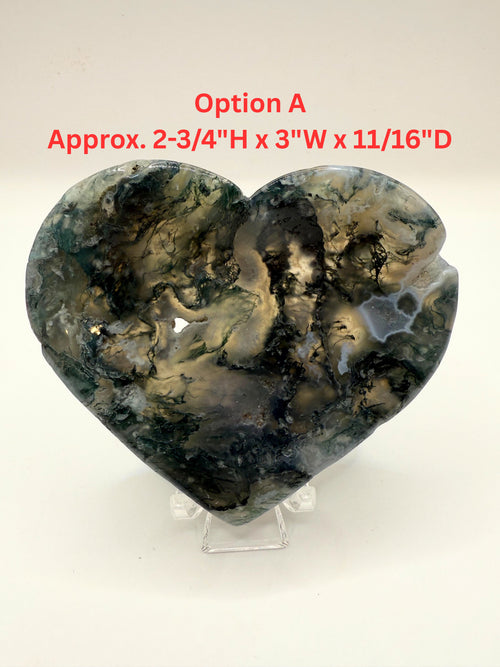 Heart-shaped polished stone or crystal display on a clear stand against a white background, with red text overlay reading 'Option A Approx. 2-3/4" H x 3" W x 11/16" D'.